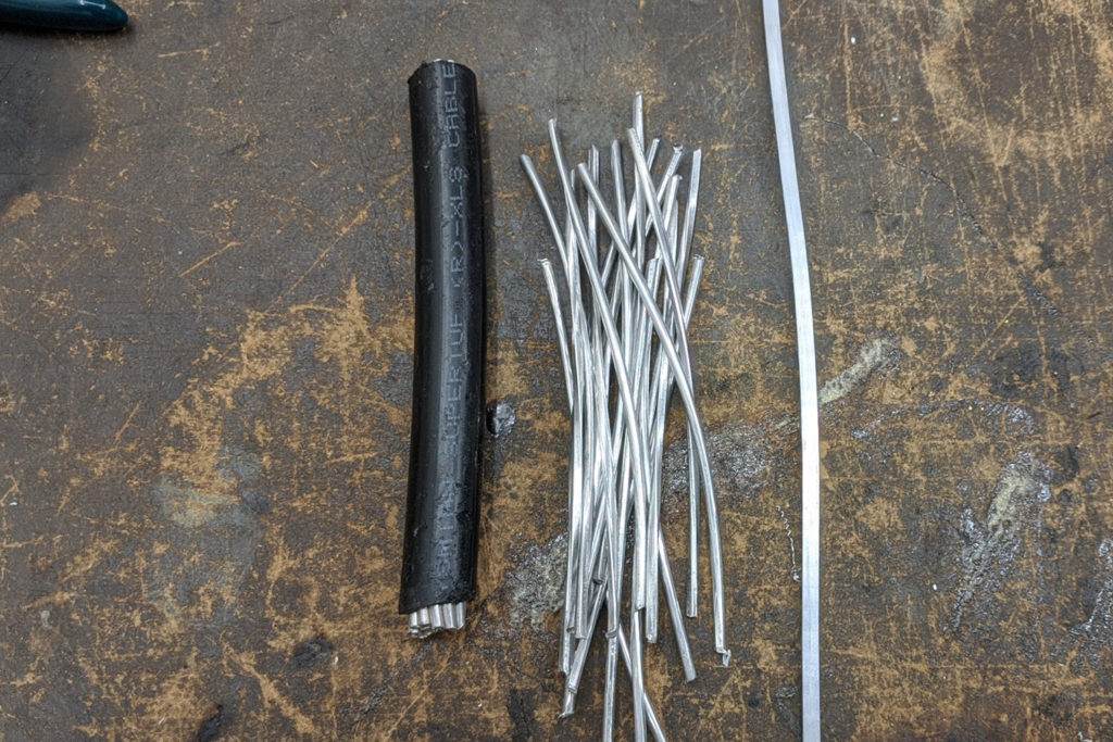 A 3-foot-long section of surplus aluminum cable can be stripped and deconstructed to produce thousands of reinforcing strips for use in home-crafted face masks. (Photo By: Dean Verhoeven)