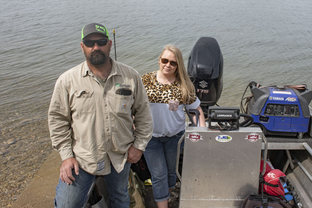 White River Valley Electric Cooperative’s David Byrne and his wife, Marlana, with “Lucy,” their bowfishing boat at Table Rock Lake. (Photo By: Paul Newton)