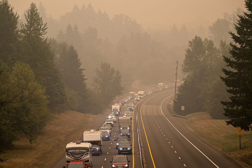 Residents flee their homes as wildfires ravage western Oregon, devastating towns served by electric cooperatives. An estimated 500,000 Oregonians, or 10% of the state's population, has been forced to evacuate. (Photo by: Nathan Howard/Getty Images)