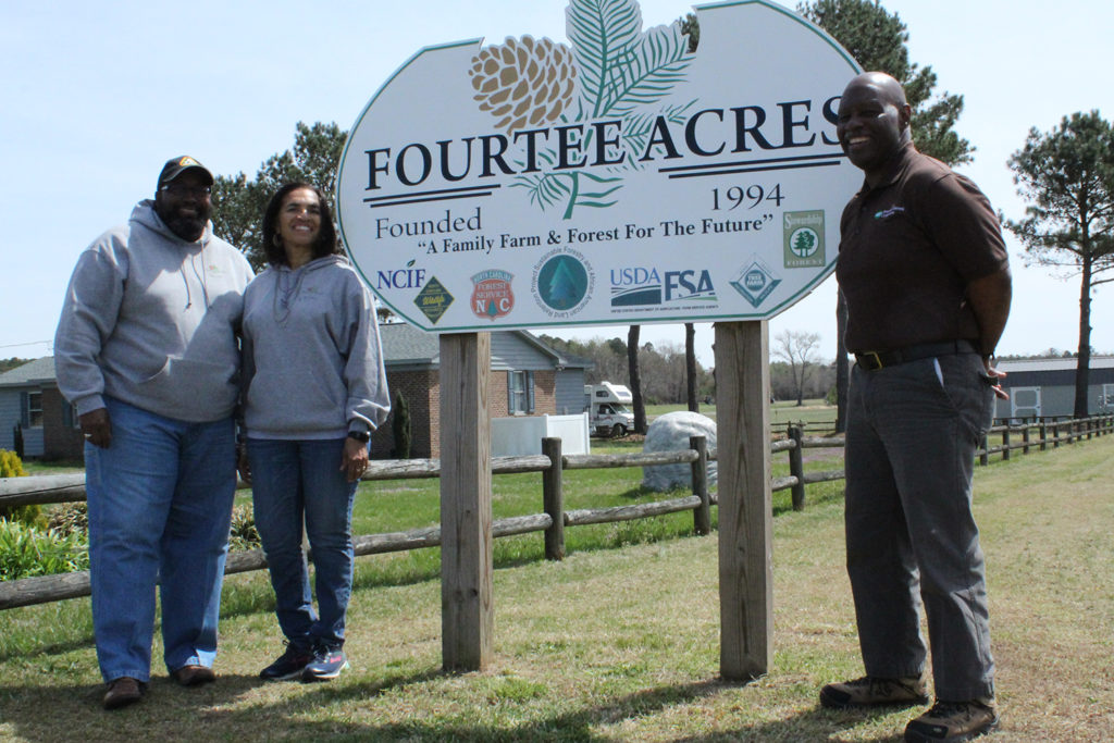 Fourtee Acre Farms owners Tyrone and Edna Williams plan to pass Fourtee Acre Farms on to future generations. At right is Roanoke Electric Cooperative’s Alton Perry. (Photo Courtesy: North Carolina Forestry Department)