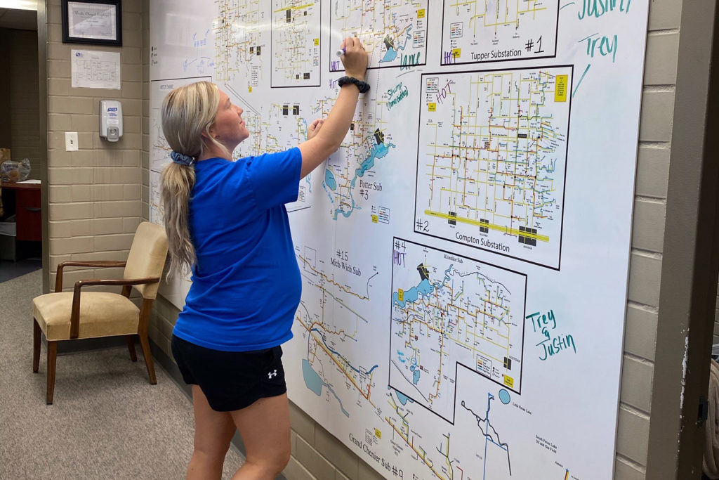 Jeff Davis Electric Cooperative’s Ana Davis updates substation information, one of many tasks during Hurricane Laura power restoration. (Photo By: Winnie Farris)