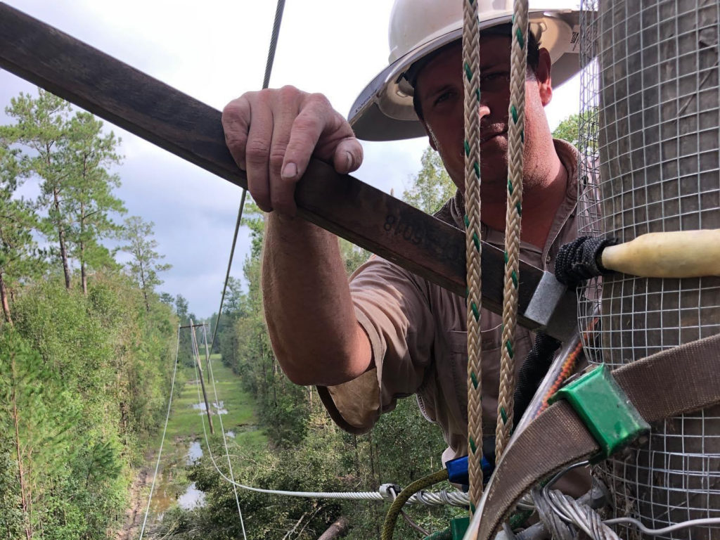 Brian Lasiter, a lineworker from Covington Electric Cooperative in Alabama, works on a damaged distribution line in the Beauregard Electric Cooperative service area in the aftermath of Hurricane Laura. (Photo Courtesy: Covington Electric Cooperative)