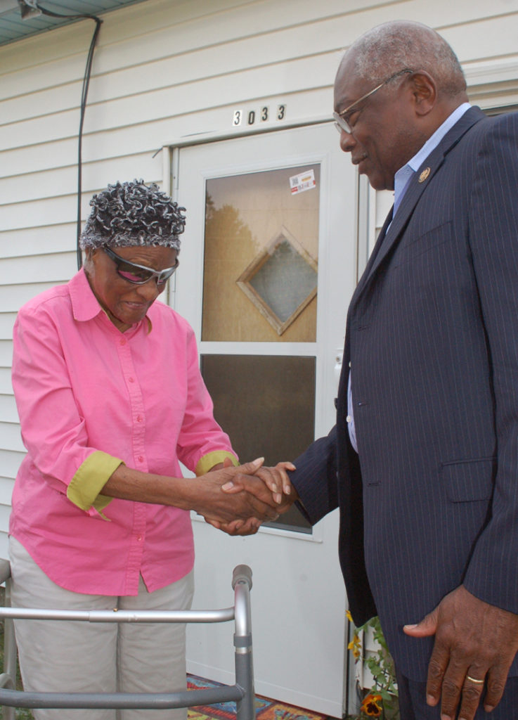 Martha Scott greets Rep. Jim Clyburn, in front of her newly weatherized home in Trio, S.C. Clyburn, D-S.C., introduced the Rural Energy Savings Program in Congress. (Photo By: Walter Allread, South Carolina Living)
