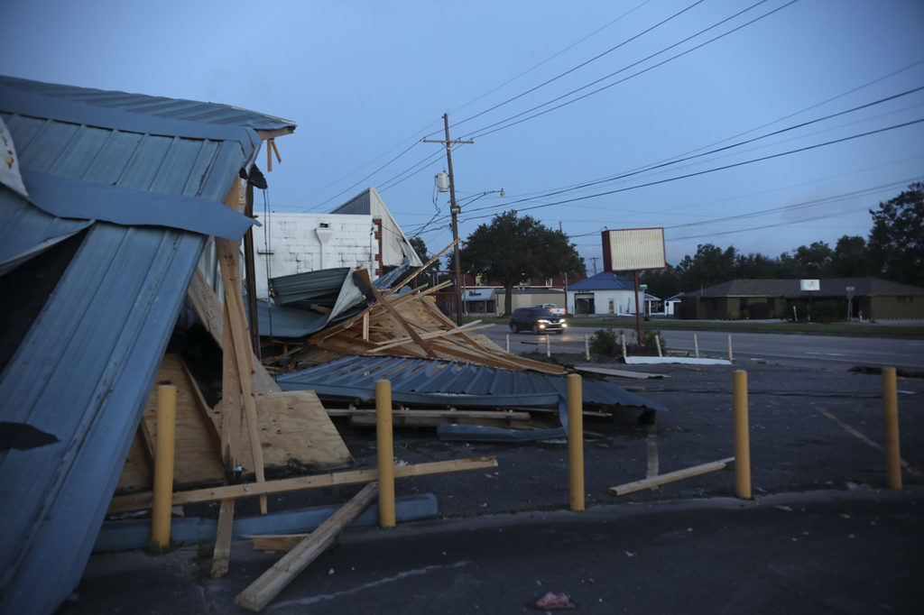 Workers clear debris from Hurricane Zeta on Oct. 29 in St. Bernard, Louisiana. (Photo By: Sandy Huffaker/Getty Images)