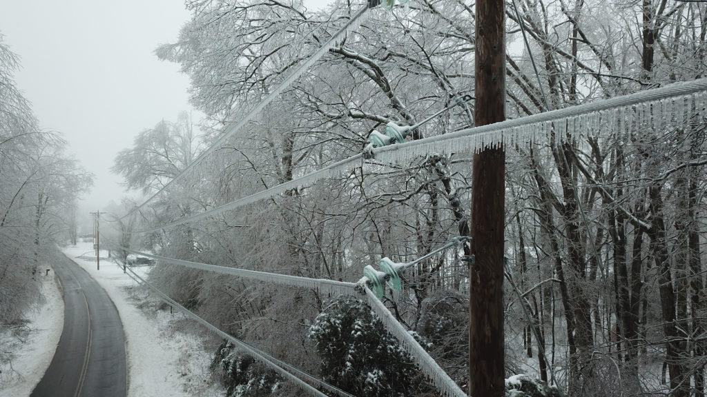 Winter storms that swept across the Mid-South left heavy accumulations of ice on power lines, causing power outages that still have co-op crews making repairs this week. (Photo By: Duck River EMC) 