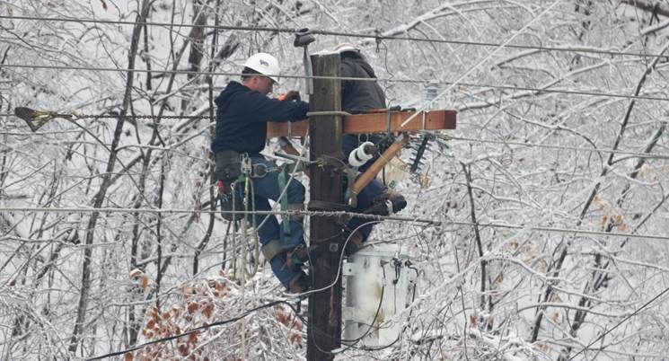 Line technicians from Licking Valley Rural Electric Cooperative work to restore power following an ice storm near West Liberty, Kentucky. (Photo By: Licking Valley RECC)