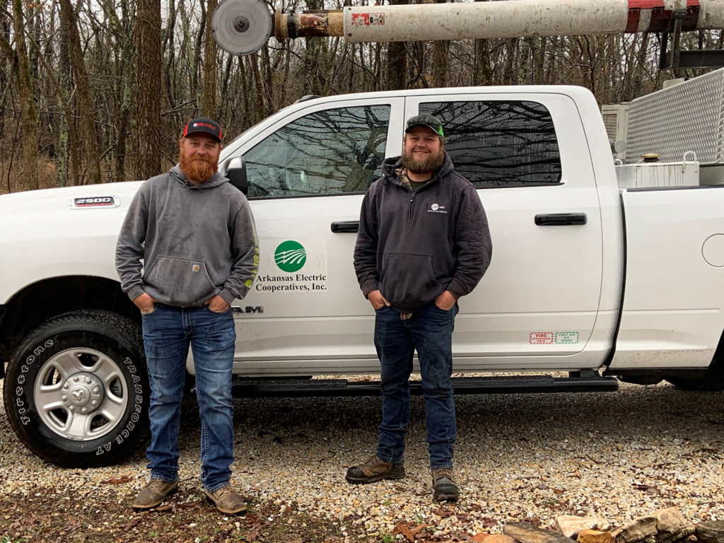 Senior foreman Chastin McLain and mechanized trimmer operator Rodney Etheridge trim trees for Arkansas Electric Cooperative Inc.’s construction and maintenance division. (Photo By: AECC)